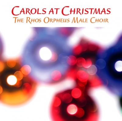 Red Christmas lettering sits above a defocused field of glowing red, orange, blue and violet lights.