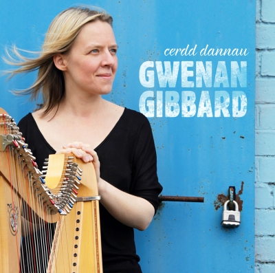 A woman in a black top holds a harp before a vivid blue door, with white lettering reading “cerdd dannau” and “GWENAN GIBBARD”.