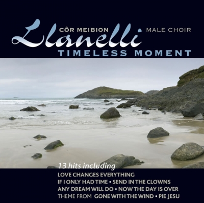 Album cover with ornate lettering above a photograph of a rocky, overcast beach and a small song list over the lower edge.